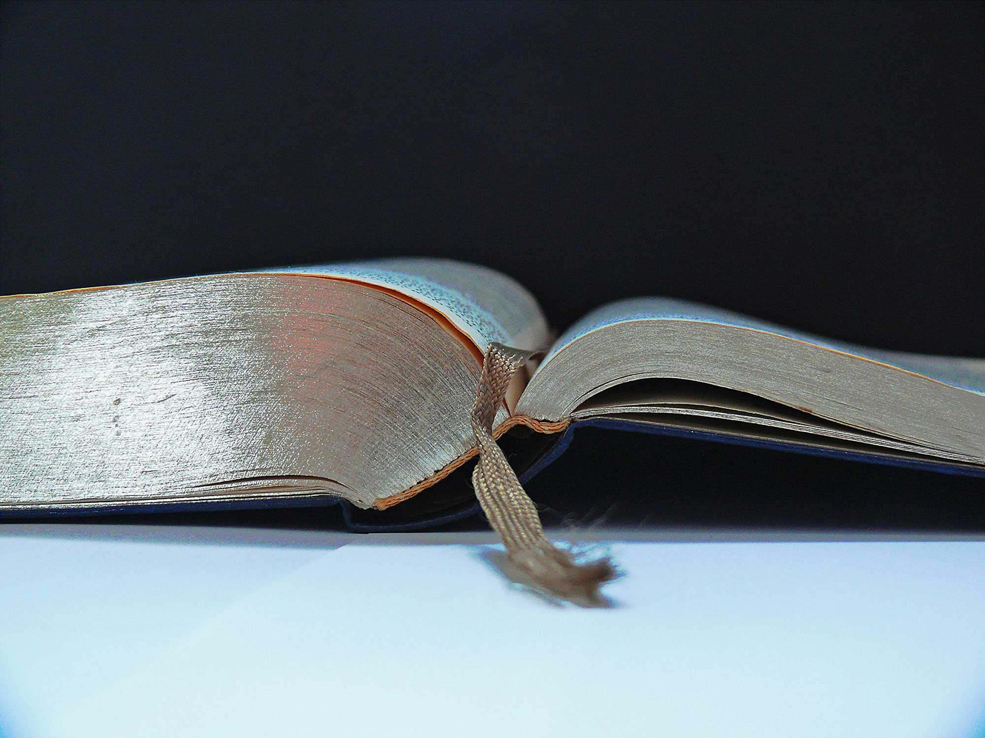 Closeup of the bottom of an open book on a table